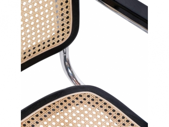 Sillón negro con ratán natural y acero cromado  merkamueble